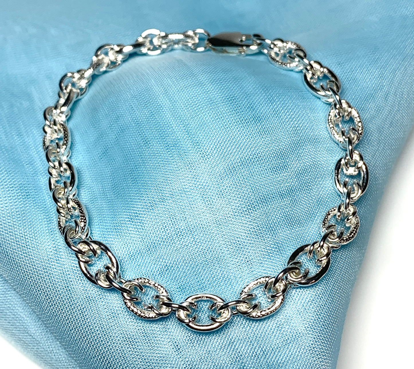 Ladies sterling silver bracelet fancy patterned solid link