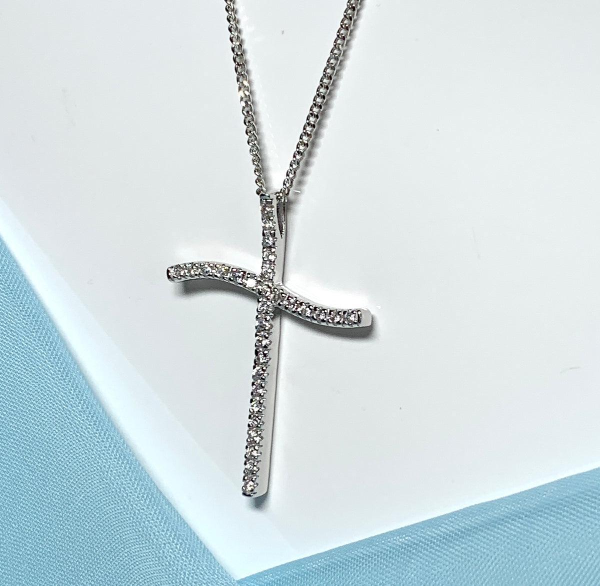 Large fancy stone set sterling silver cubic zirconia cross including chain