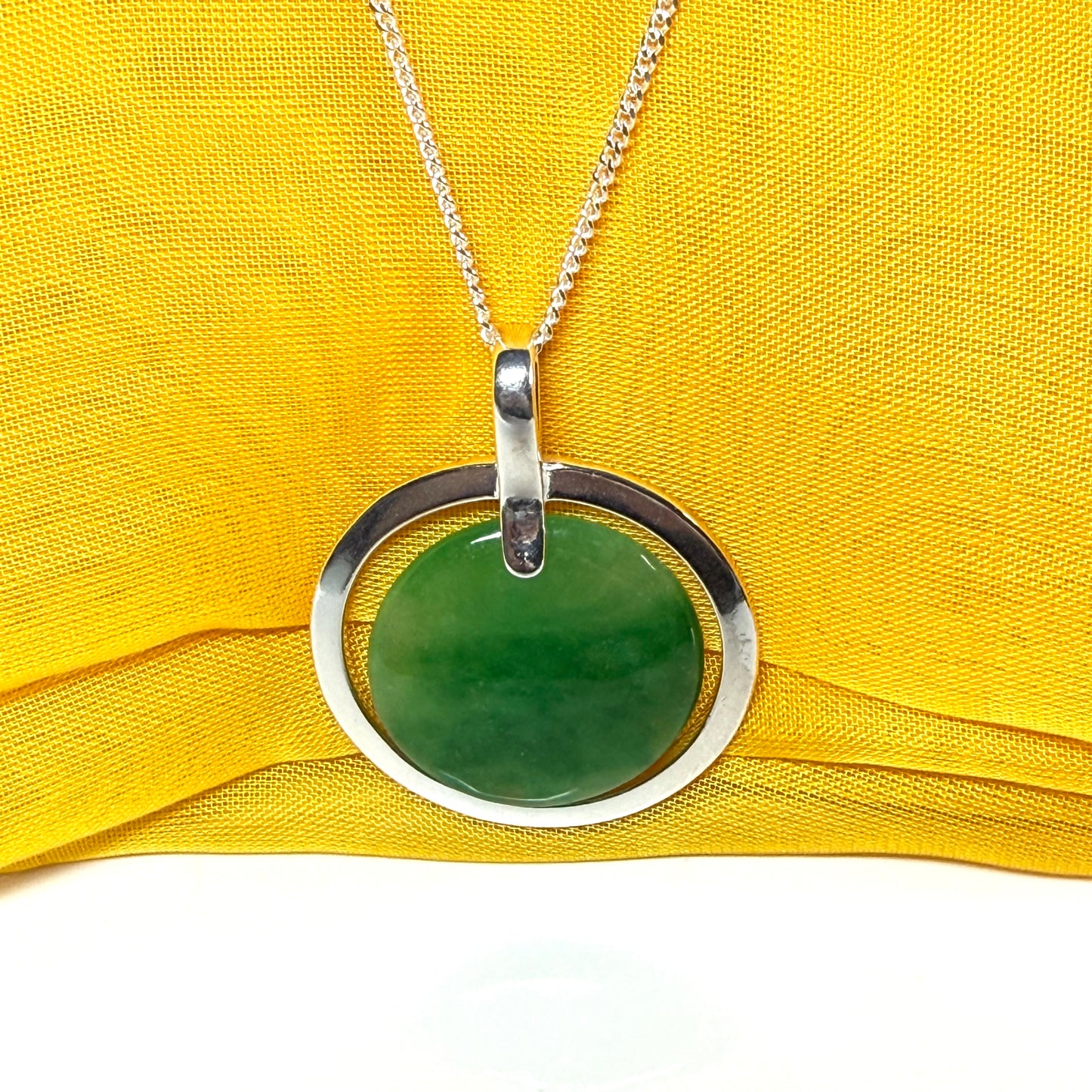 Large silver round shaped green real jade necklace pendant with a chain