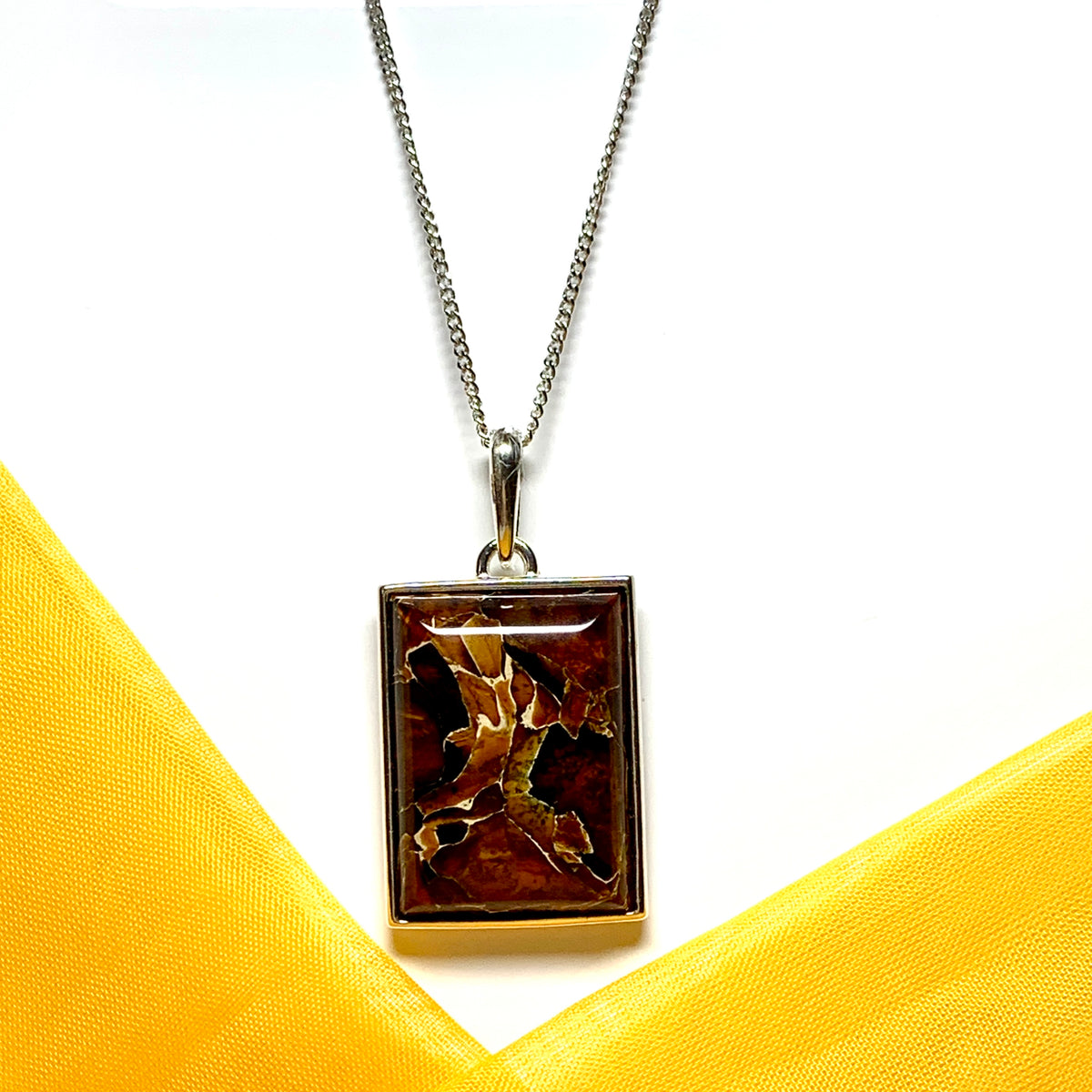 Large square rectangular ulnar shaped real amber necklace including chain