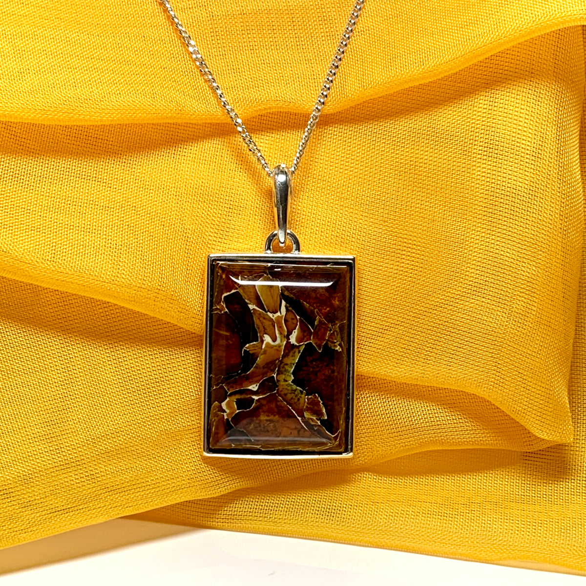 Large square rectangular ulnar shaped real amber necklace including chain