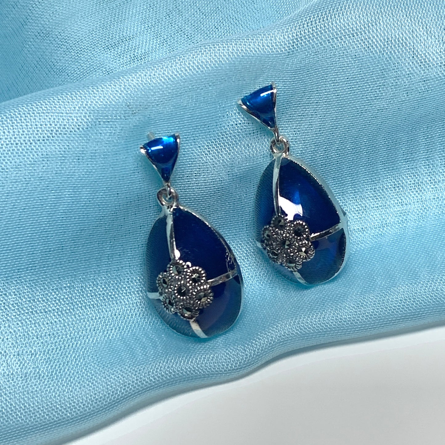 Large blue crystal drop earrings and marcasite pear teardrop