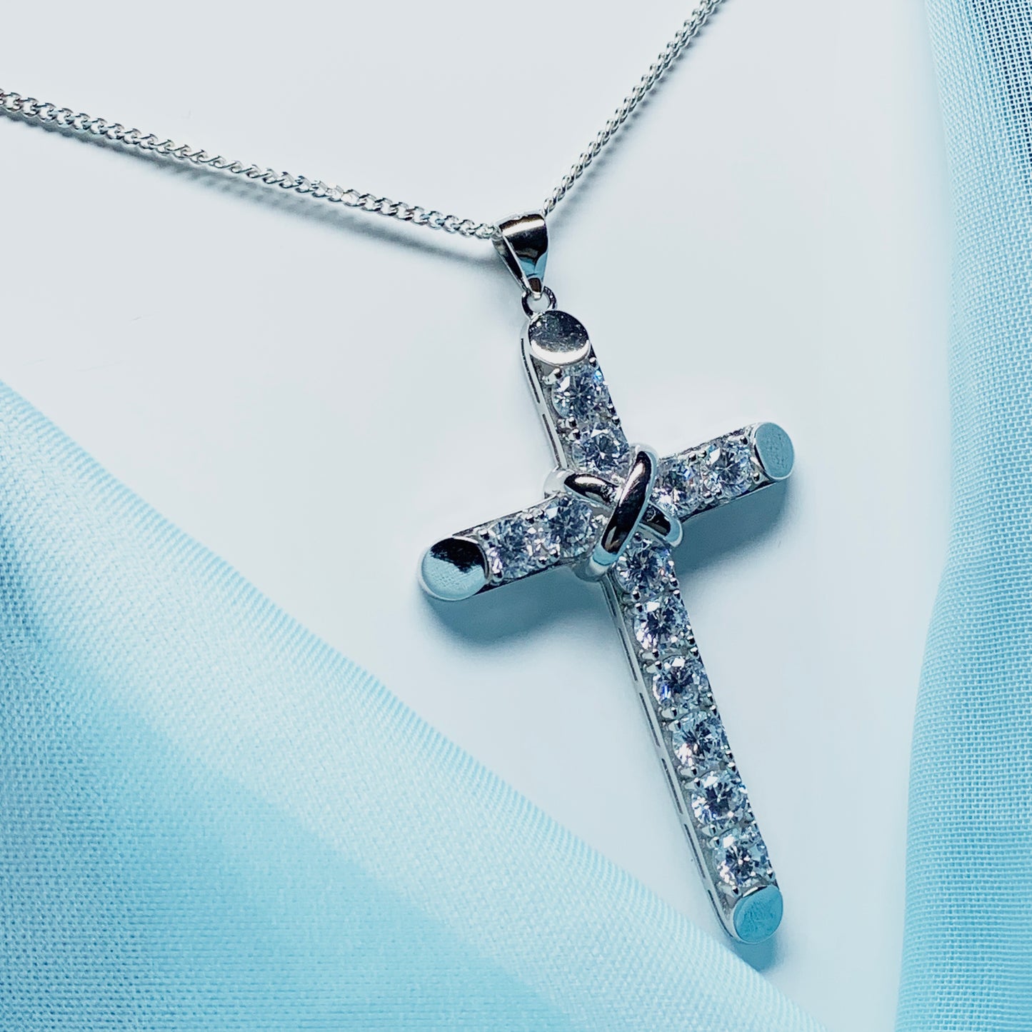 Large cubic zirconia set fancy sterling silver cross