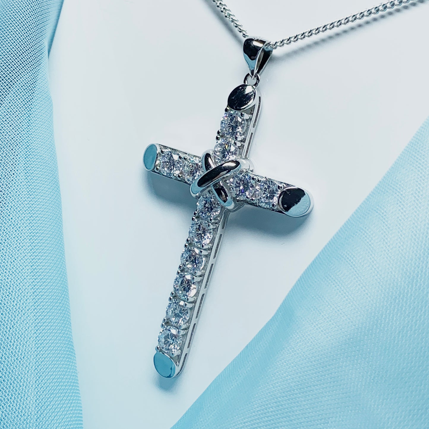 Large cubic zirconia set fancy sterling silver cross