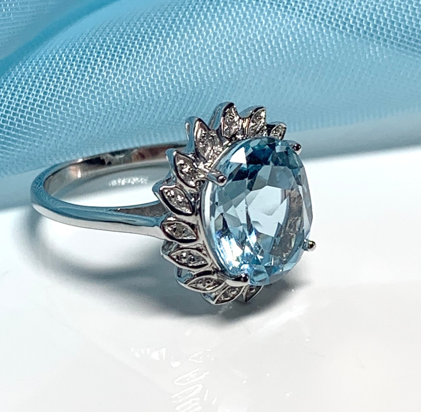 Large oval blue topaz and diamond sterling silver cluster ring