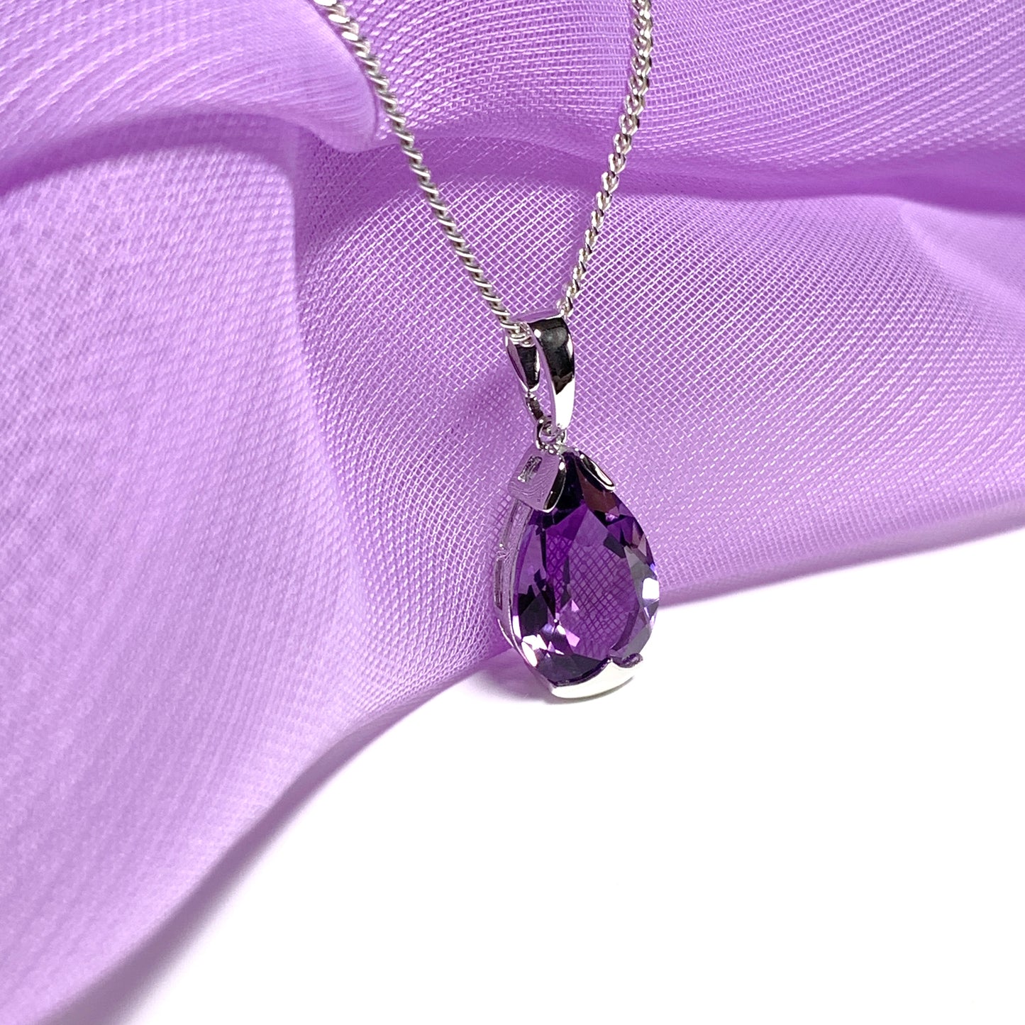 Large pear shaped purple amethyst white gold necklace