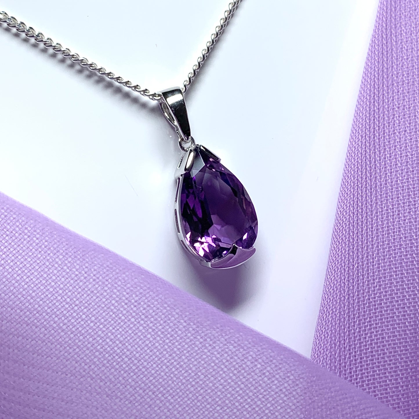 Large pear shaped purple amethyst white gold necklace