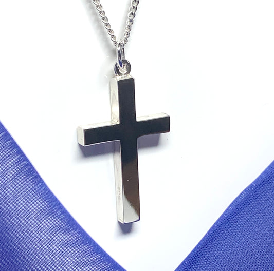Polished plain heavy solid sterling silver cross on a curb chain