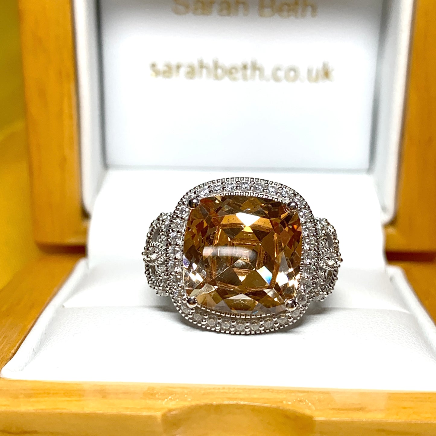 Large topaz coloured cocktail ring with decorated shoulders