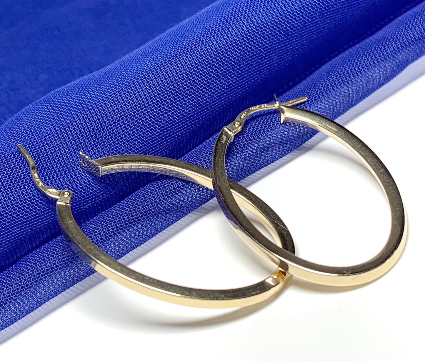 Yellow gold large oval hoop earrings plain polished