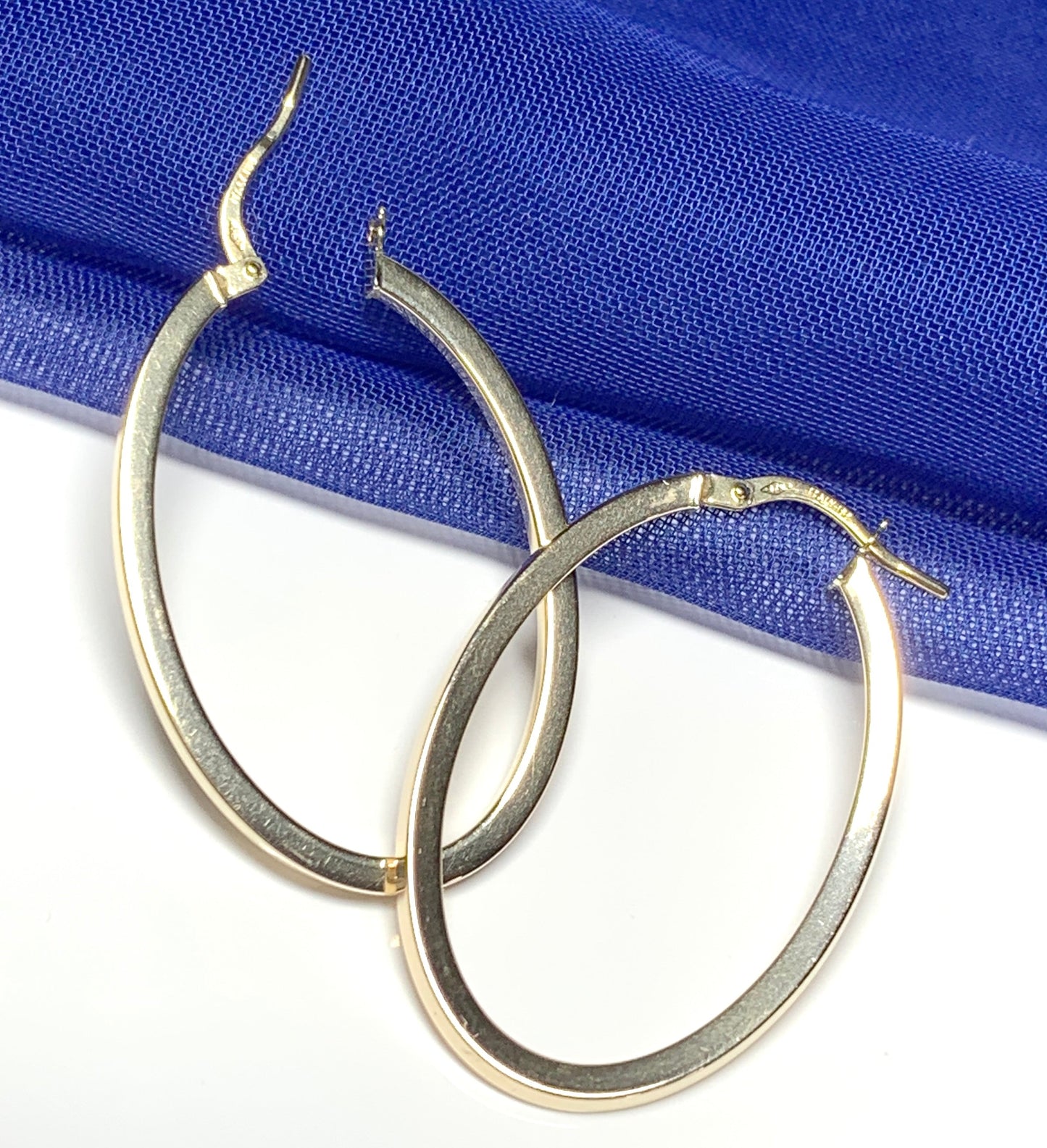 Yellow gold large oval hoop earrings plain polished