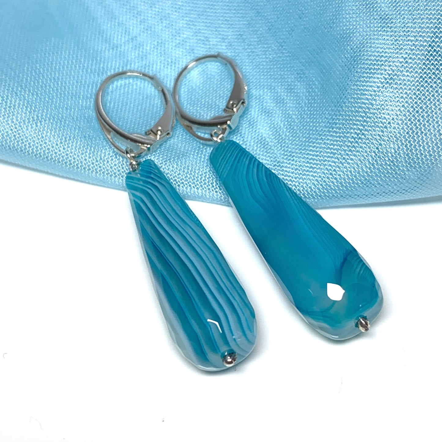 Light blue teardrop shaped long drop agate earrings