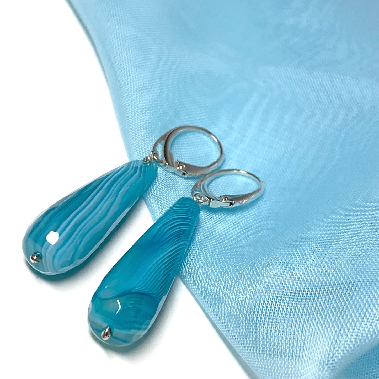 Light blue teardrop shaped long drop agate earrings