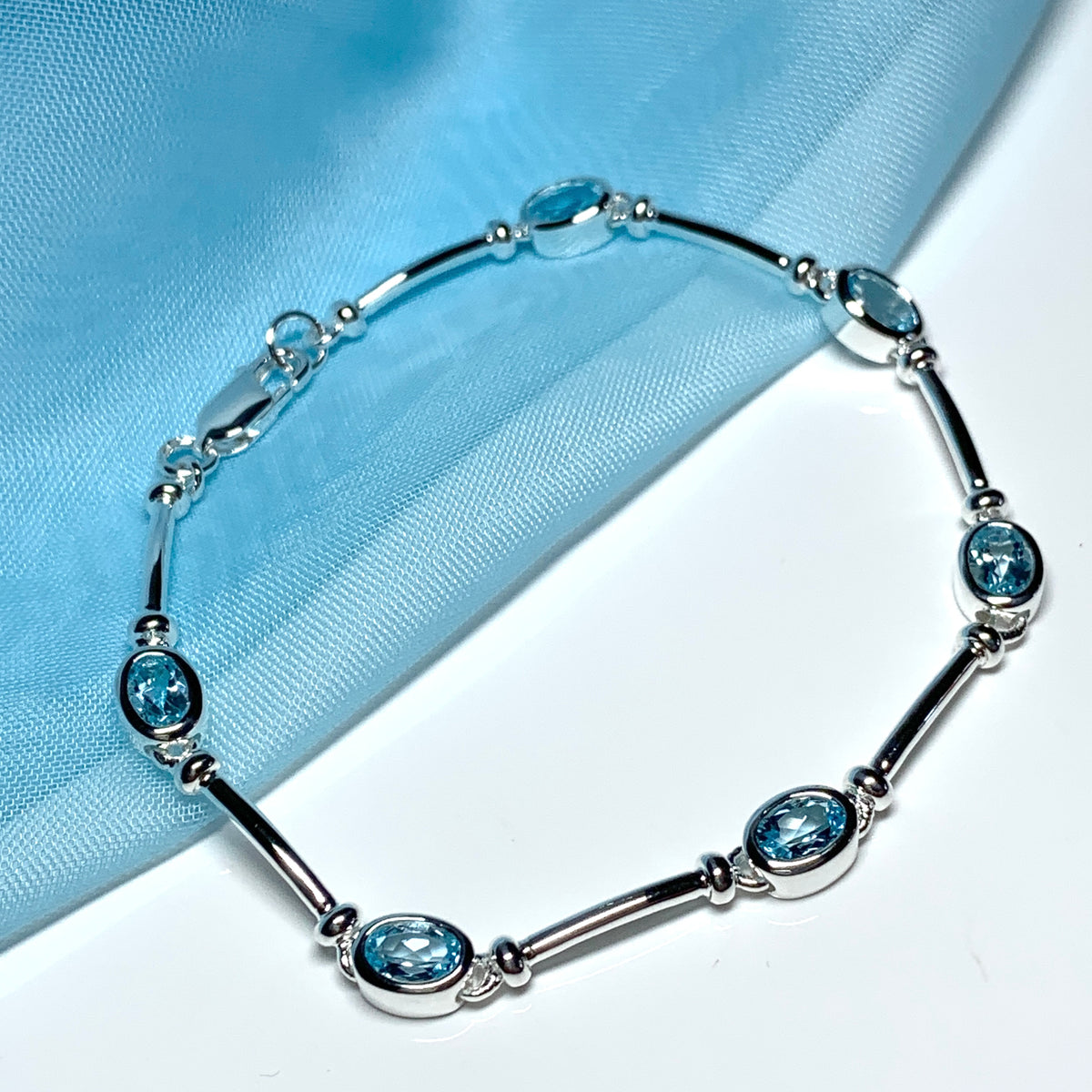 Blue topaz oval sterling silver bracelet