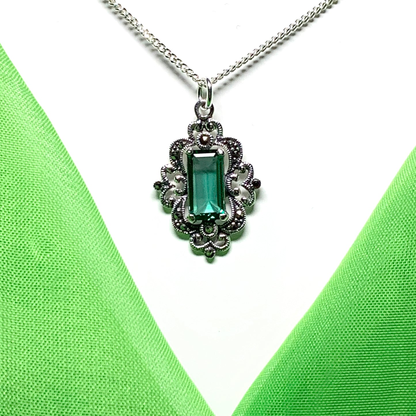Marcasite and green cubic zirconia silver large drop necklace on a chain