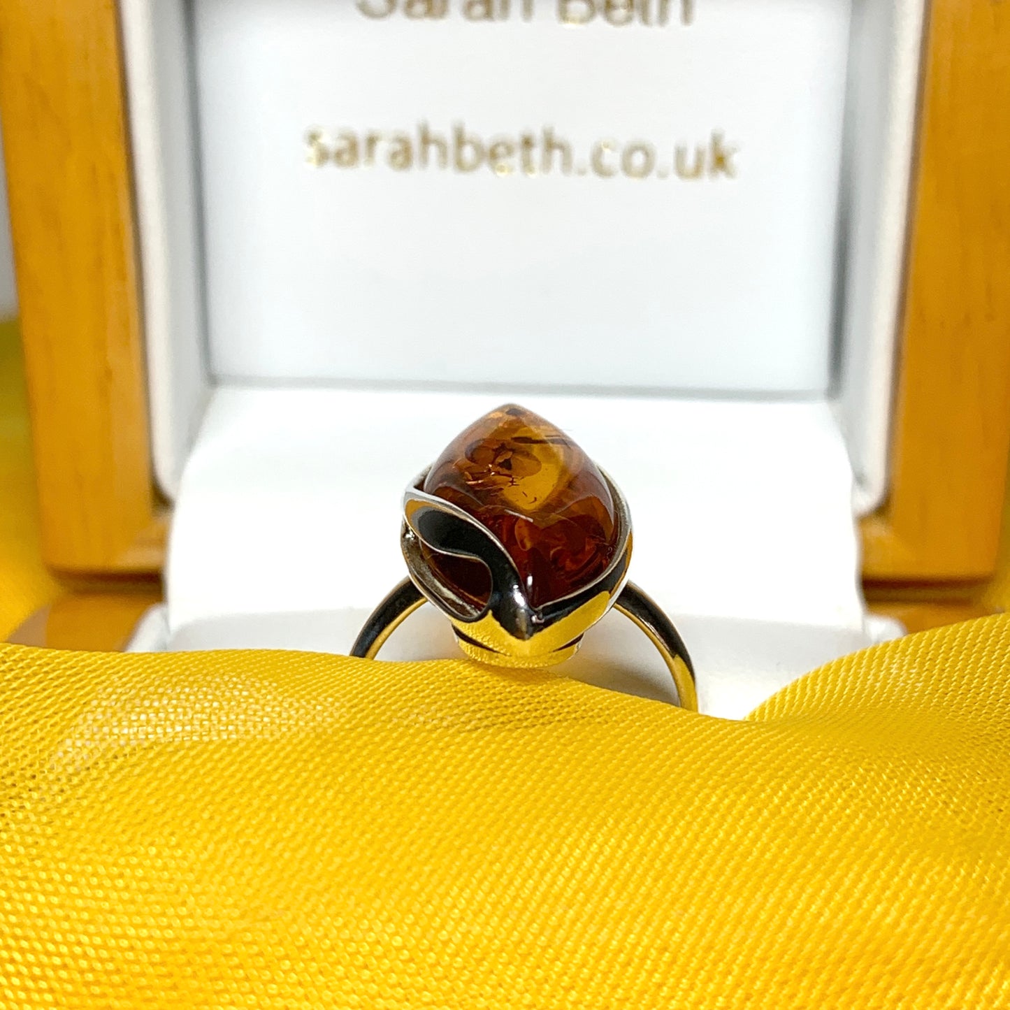 Marquise shaped sterling silver real amber ring