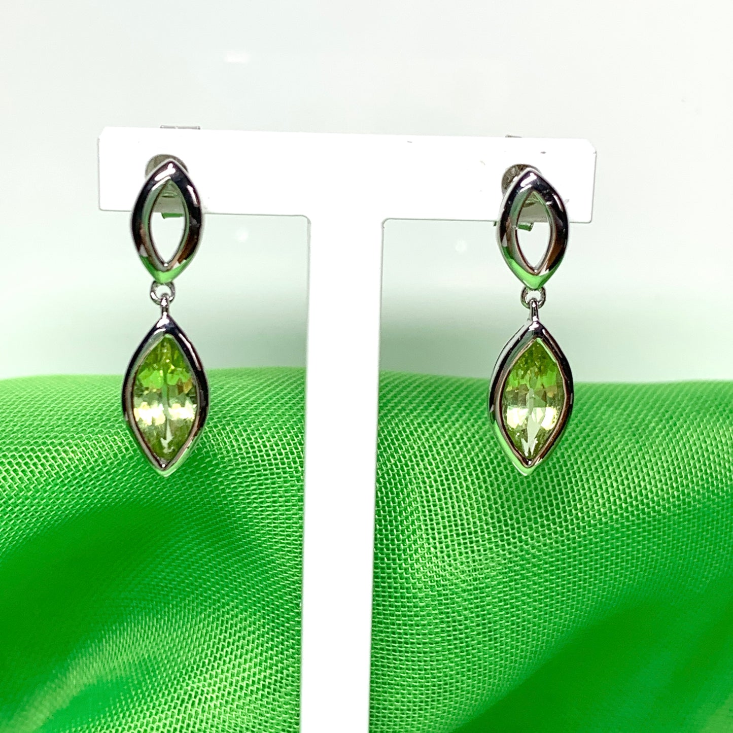 Marquise shaped peridot white gold drop earrings