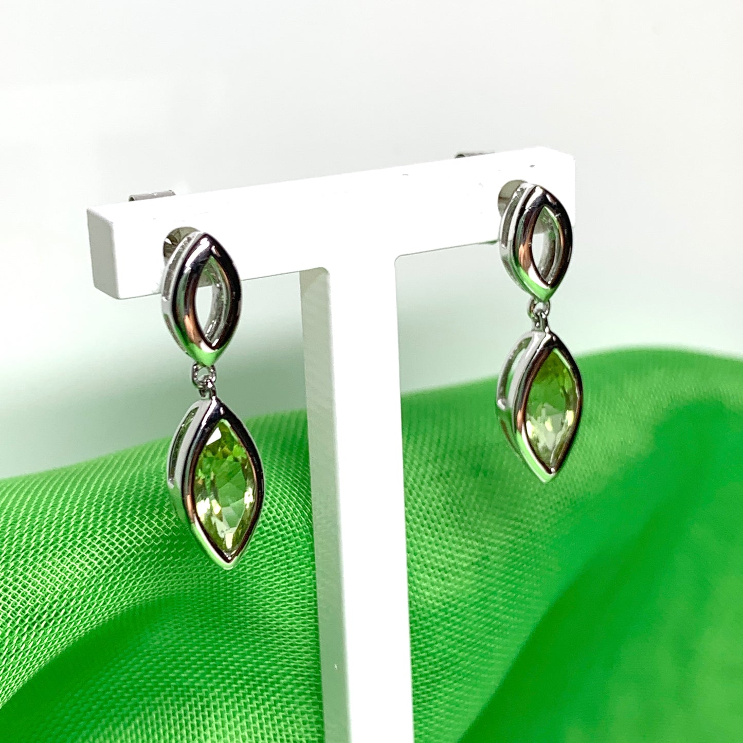 Marquise shaped peridot white gold drop earrings