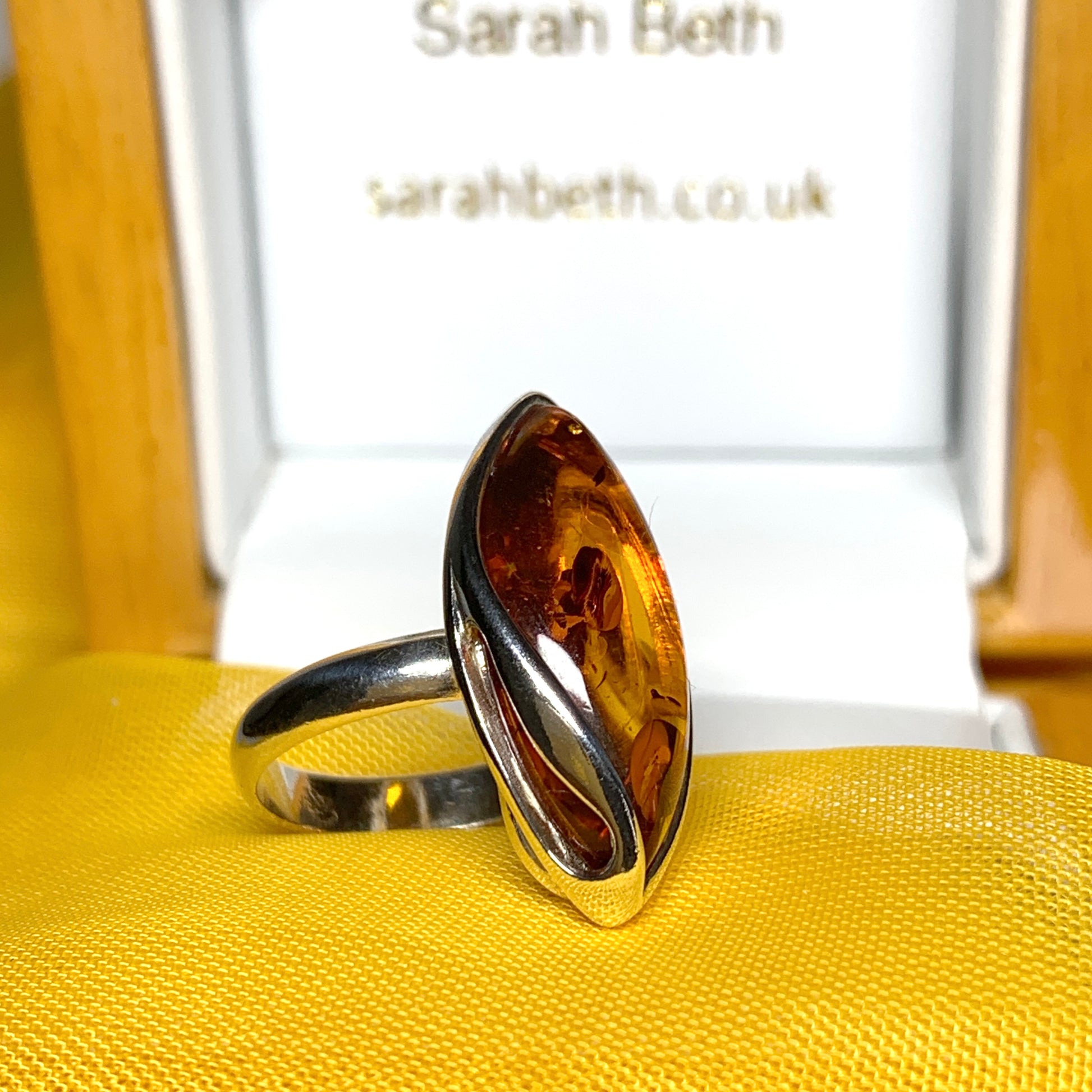 Marquise shaped sterling silver real amber ring