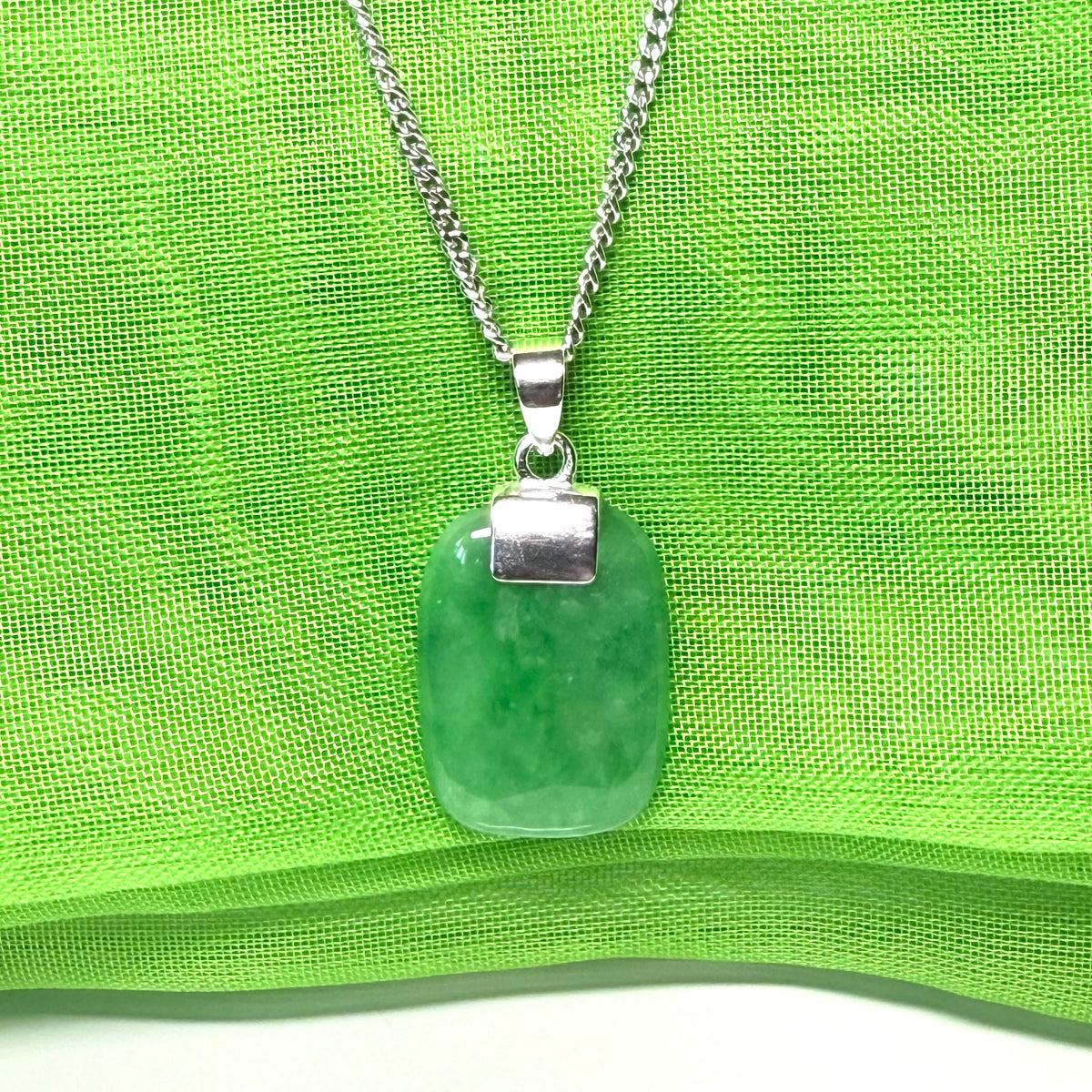 Necklace pendant having real green jade sterling silver cushion shaped with a chain included