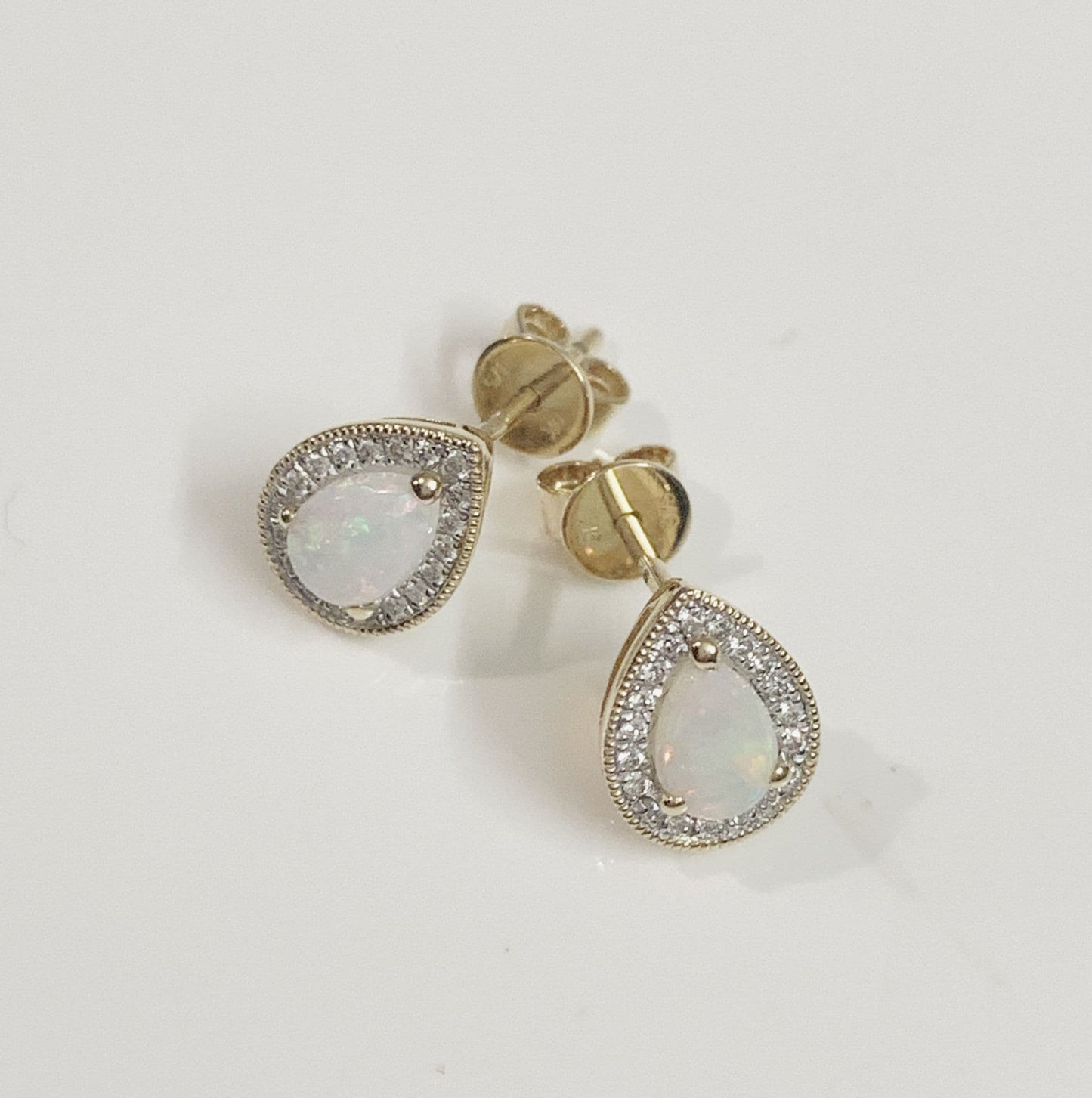 Pear teardrop opal and diamond yellow gold stud cluster earrings