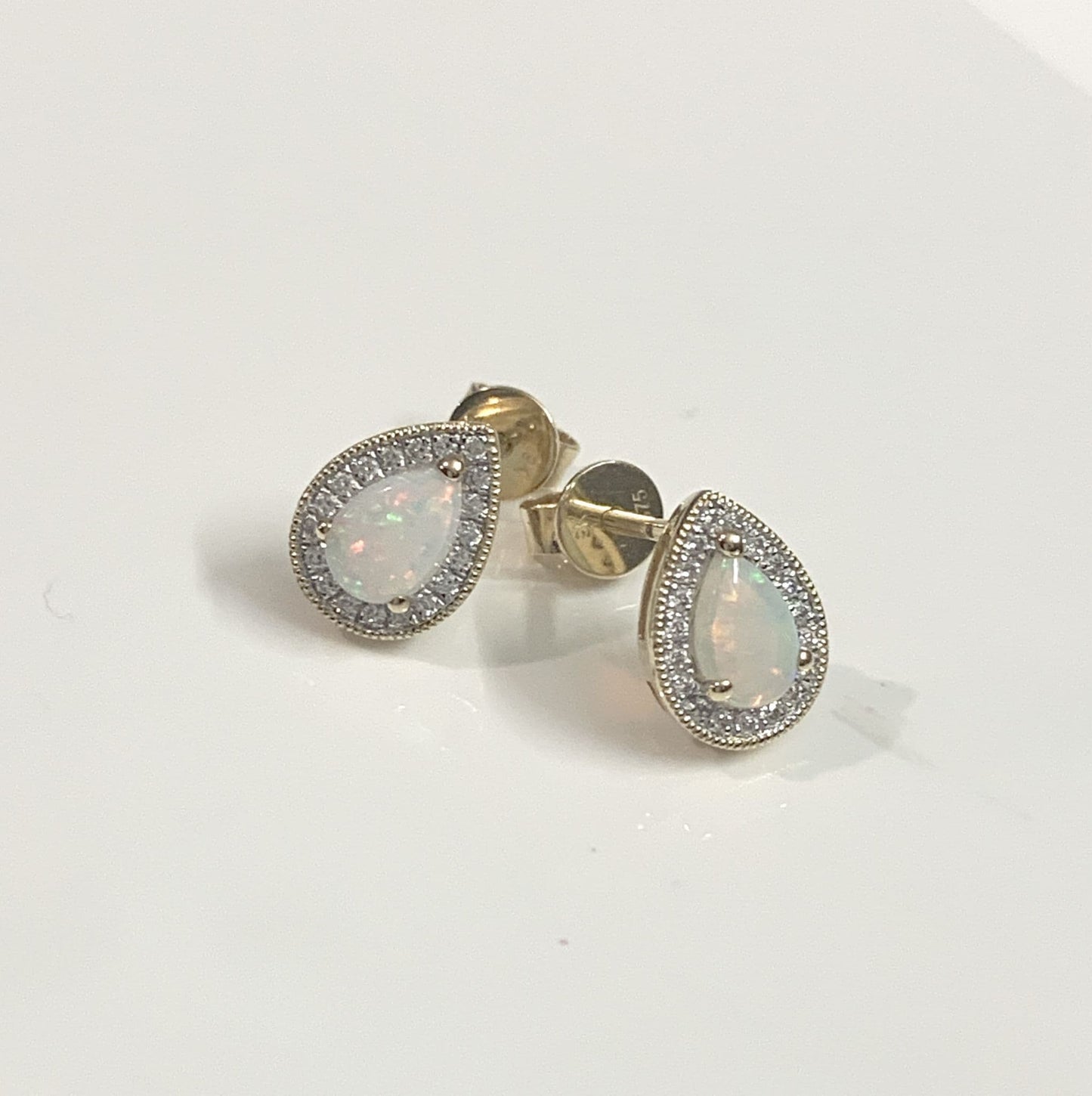 Pear teardrop opal and diamond yellow gold stud cluster earrings