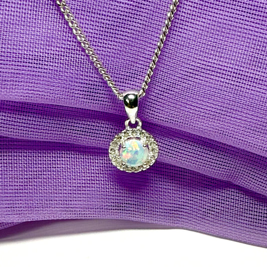 Opal necklace sterling silver round shaped and cubic zirconia pendant with a classic round design to it