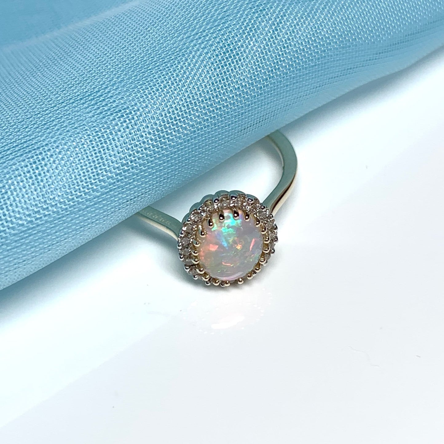 Opal oval and diamond yellow gold cluster ring