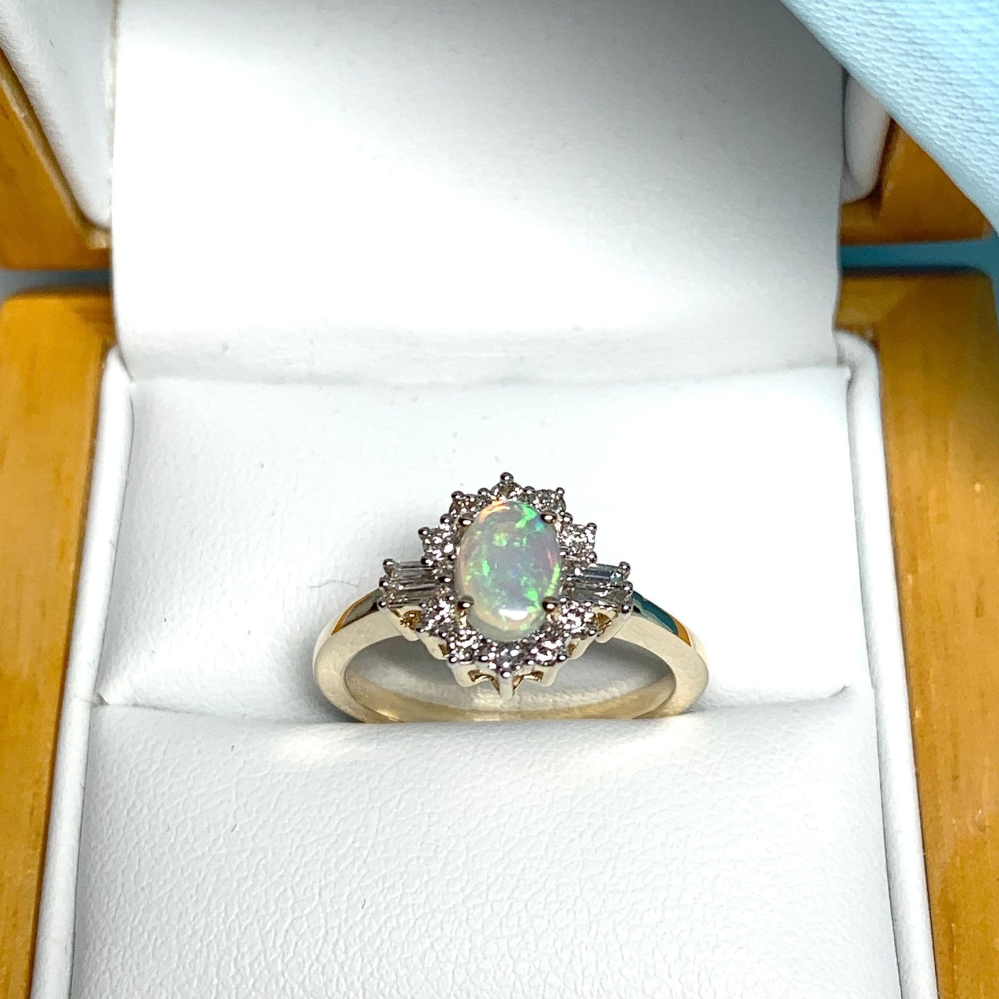 Opal and diamond yellow gold cluster ring with baguette diamonds