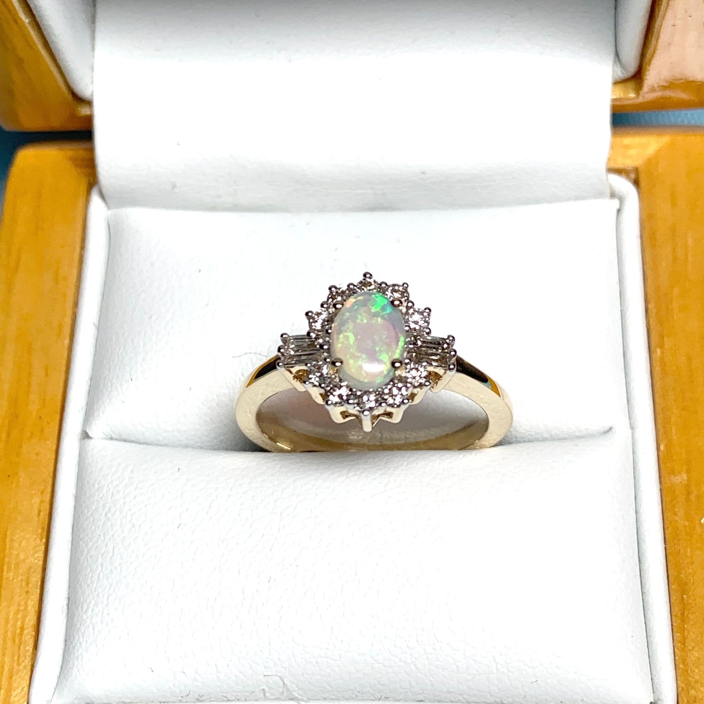 Opal and diamond yellow gold cluster ring with baguette diamonds