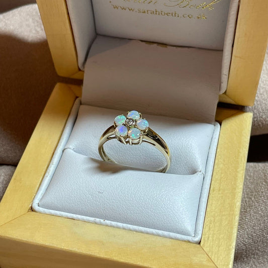 Opal and diamond yellow gold daisy cluster ring