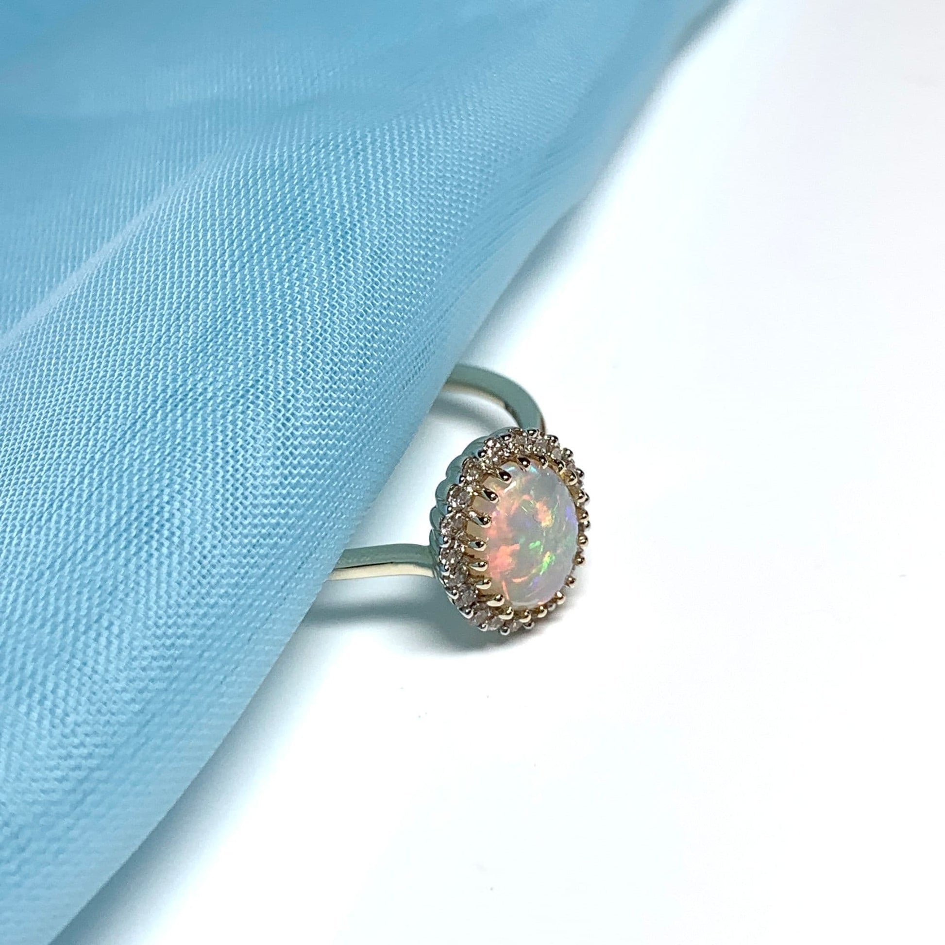 Opal oval and diamond yellow gold cluster ring