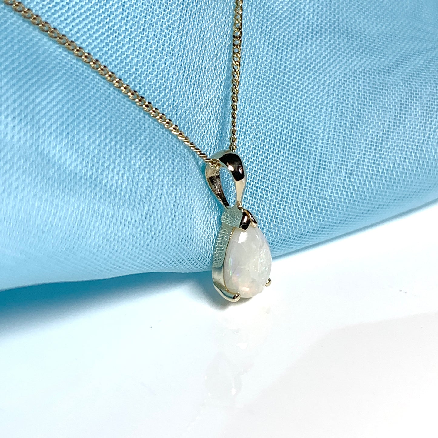 Opal yellow gold pear shaped necklace