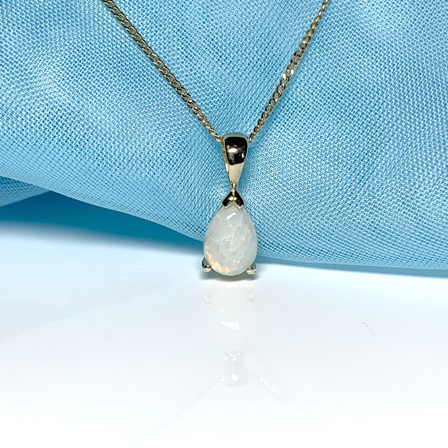 Opal yellow gold pear shaped necklace