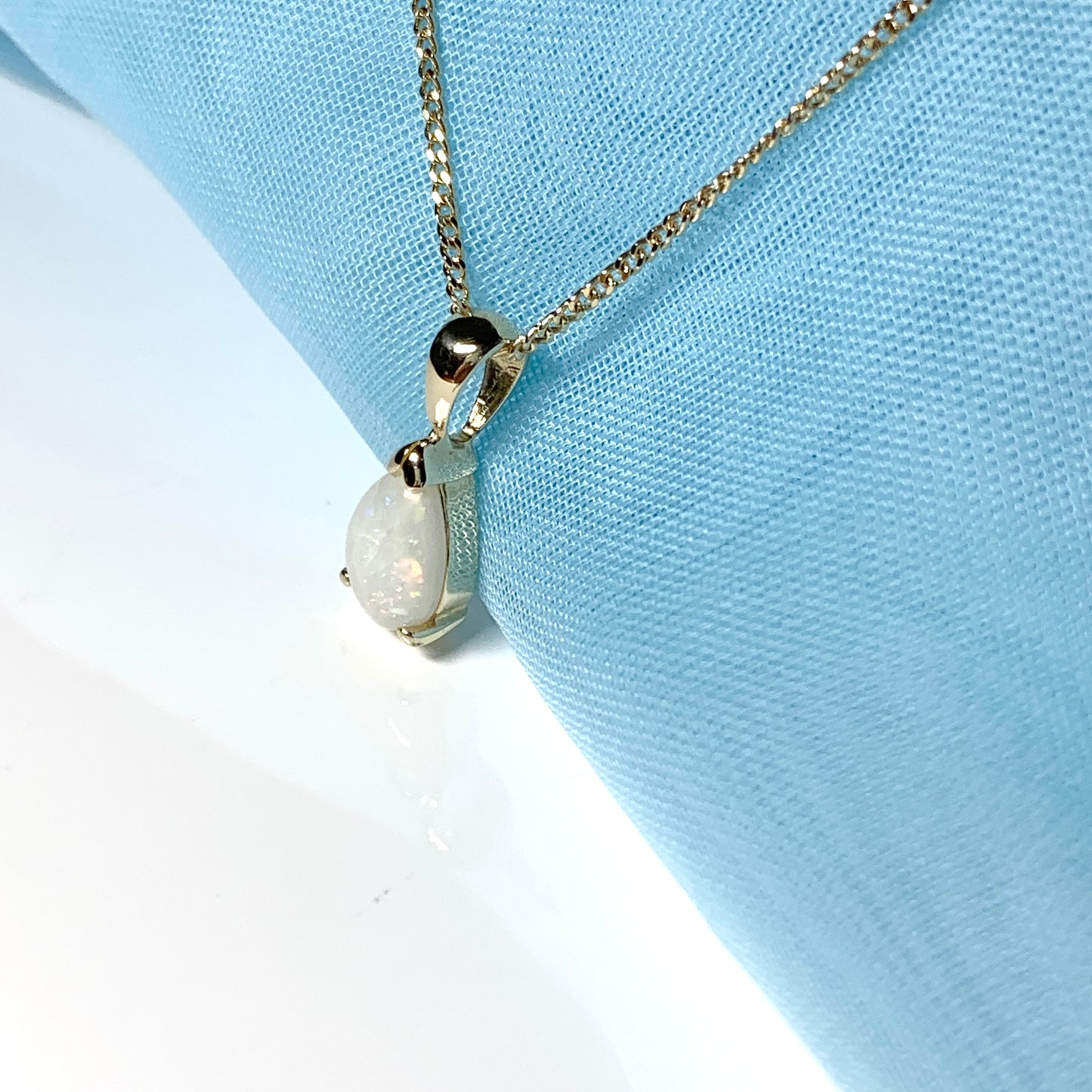 Opal yellow gold pear shaped necklace