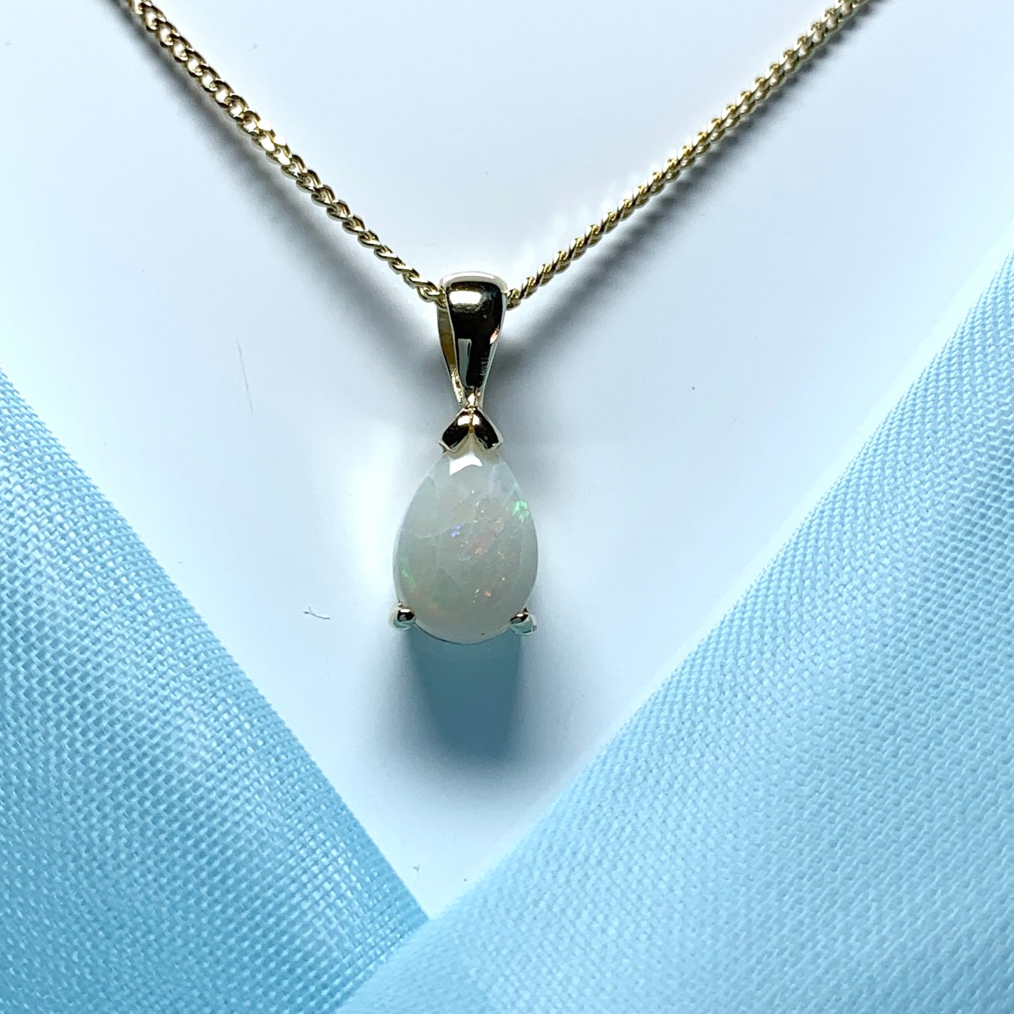 Opal yellow gold pear shaped necklace