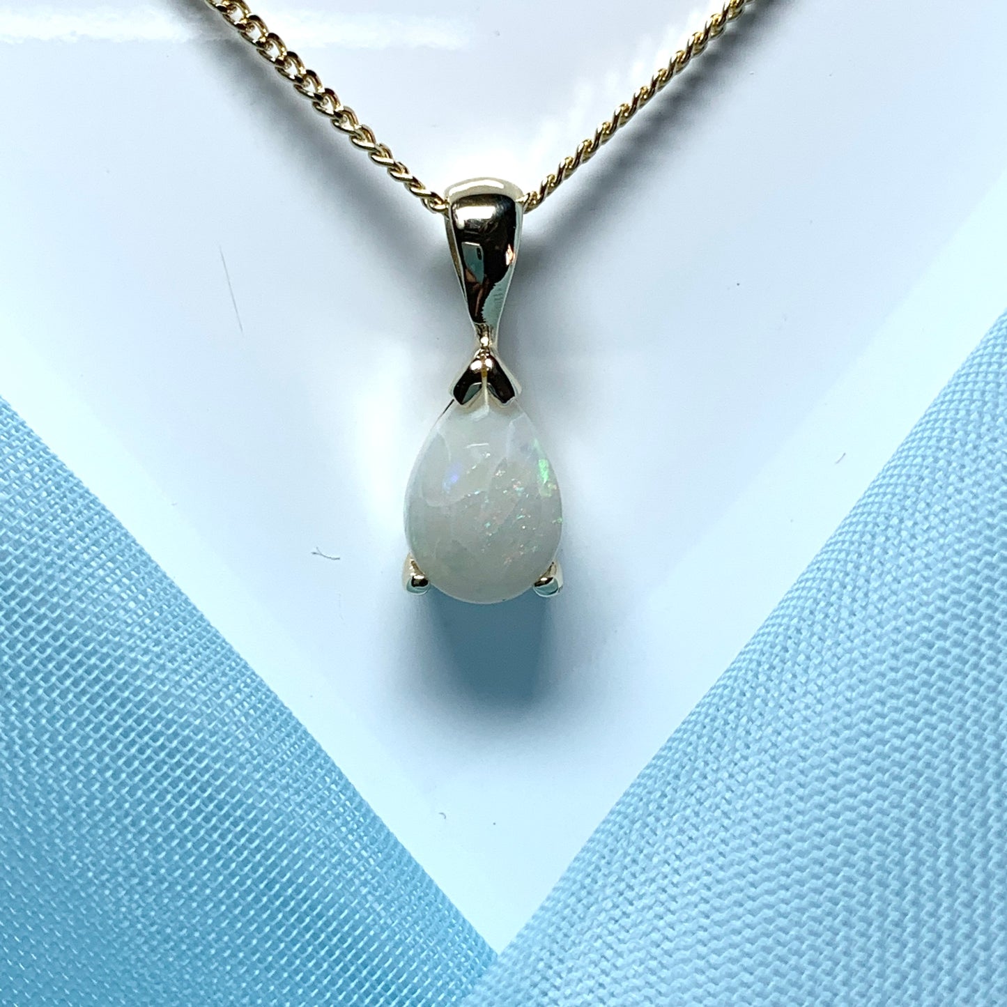 Opal yellow gold pear shaped necklace