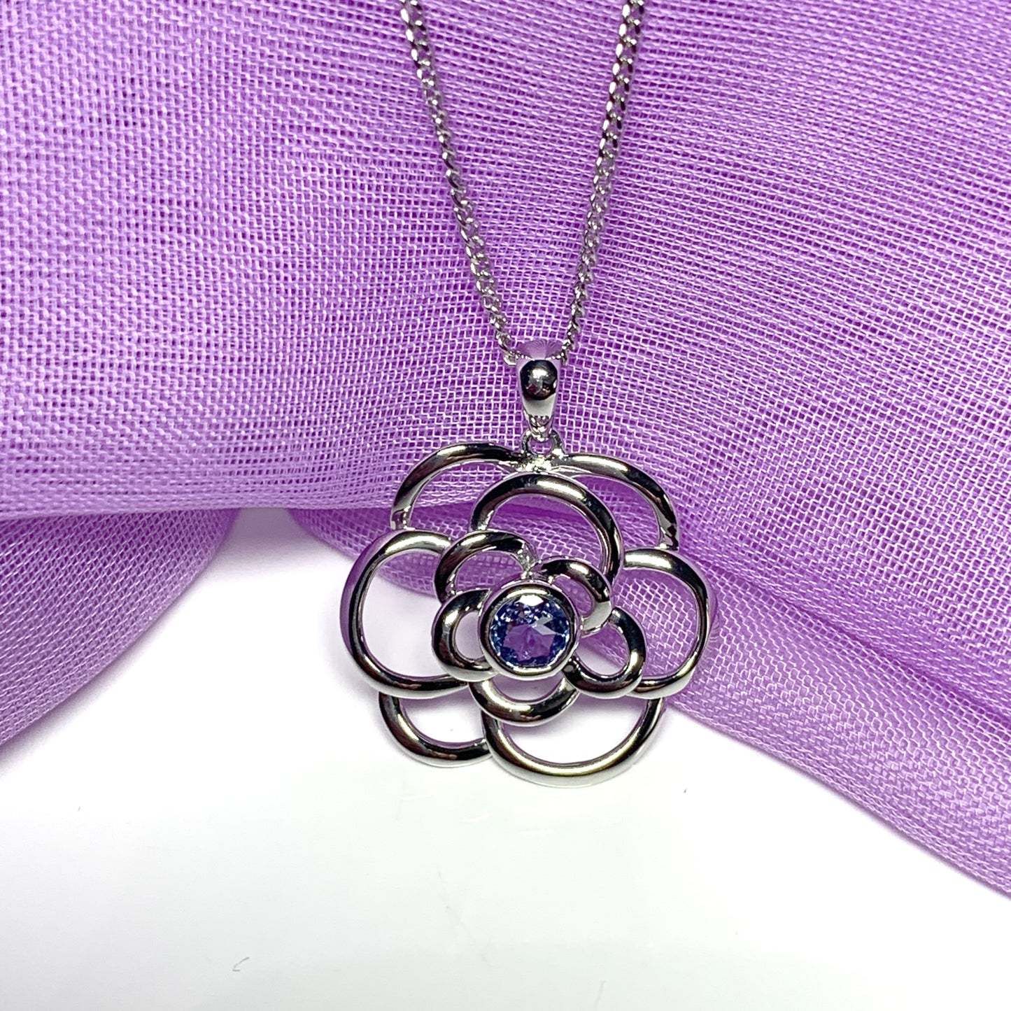 Real tanzanite round swirl necklace made in white gold