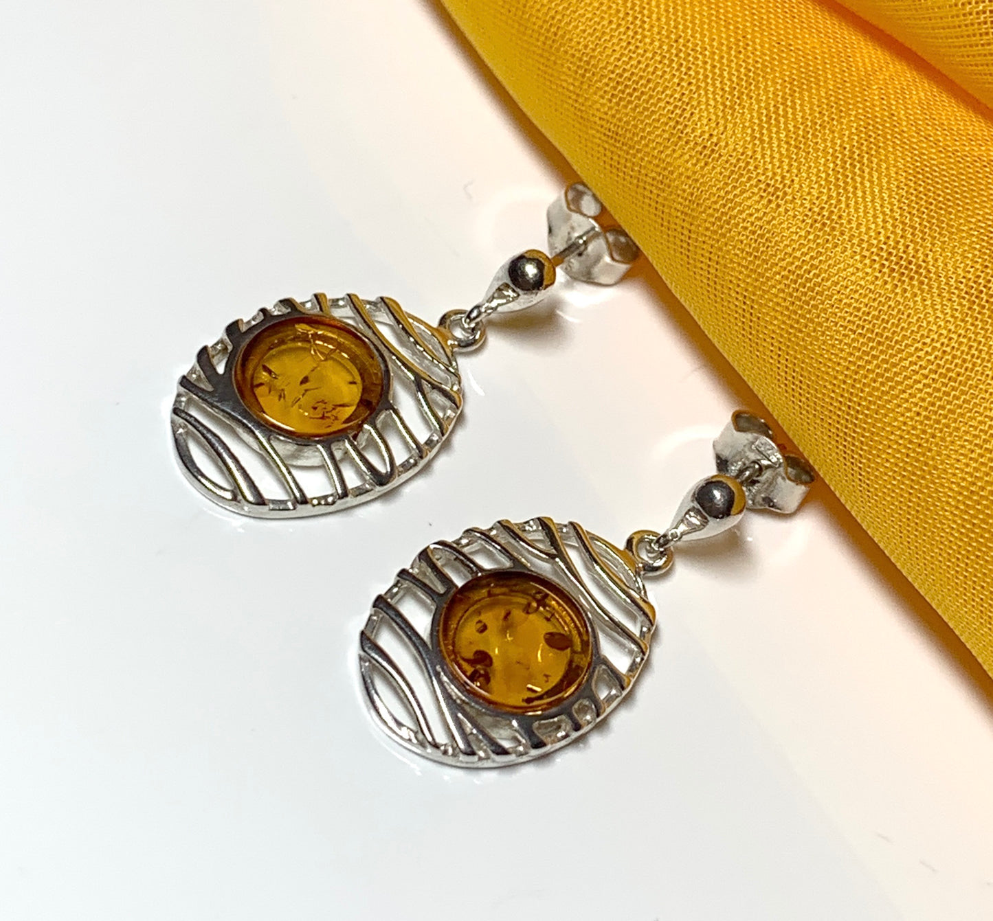 Orange real amber oval pierced open drop earrings sterling silver