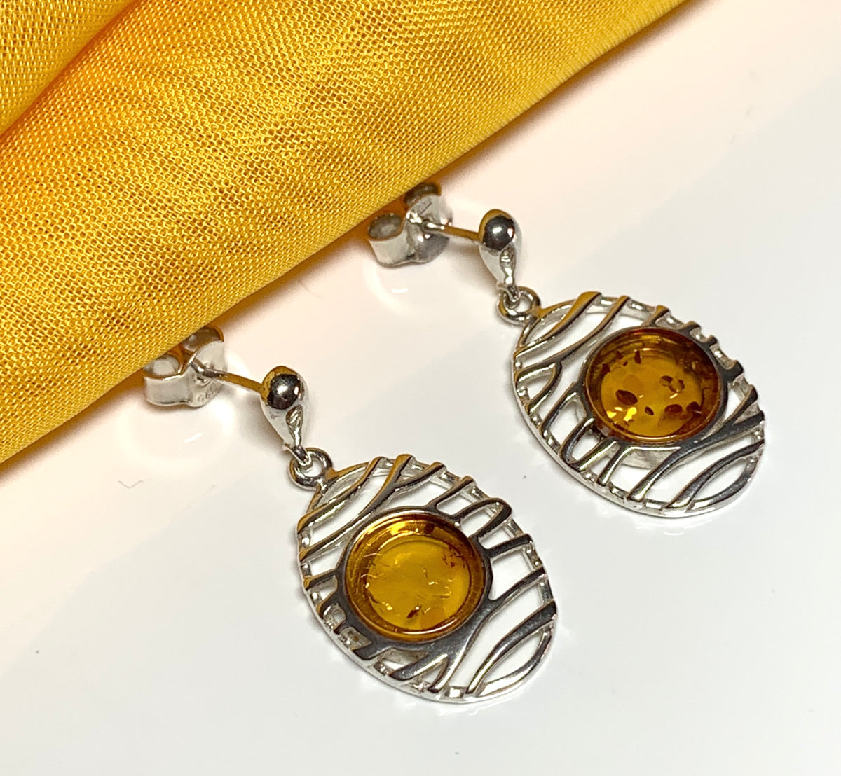 Orange real amber oval pierced open drop earrings sterling silver