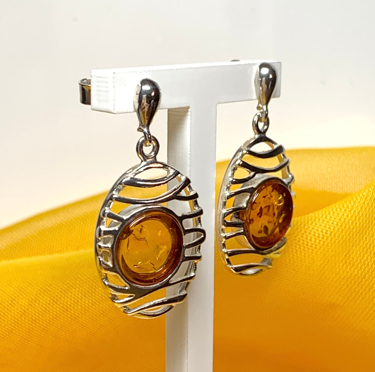 Orange real amber oval pierced open drop earrings sterling silver