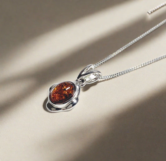 Orange amber oval cushion sterling silver necklace