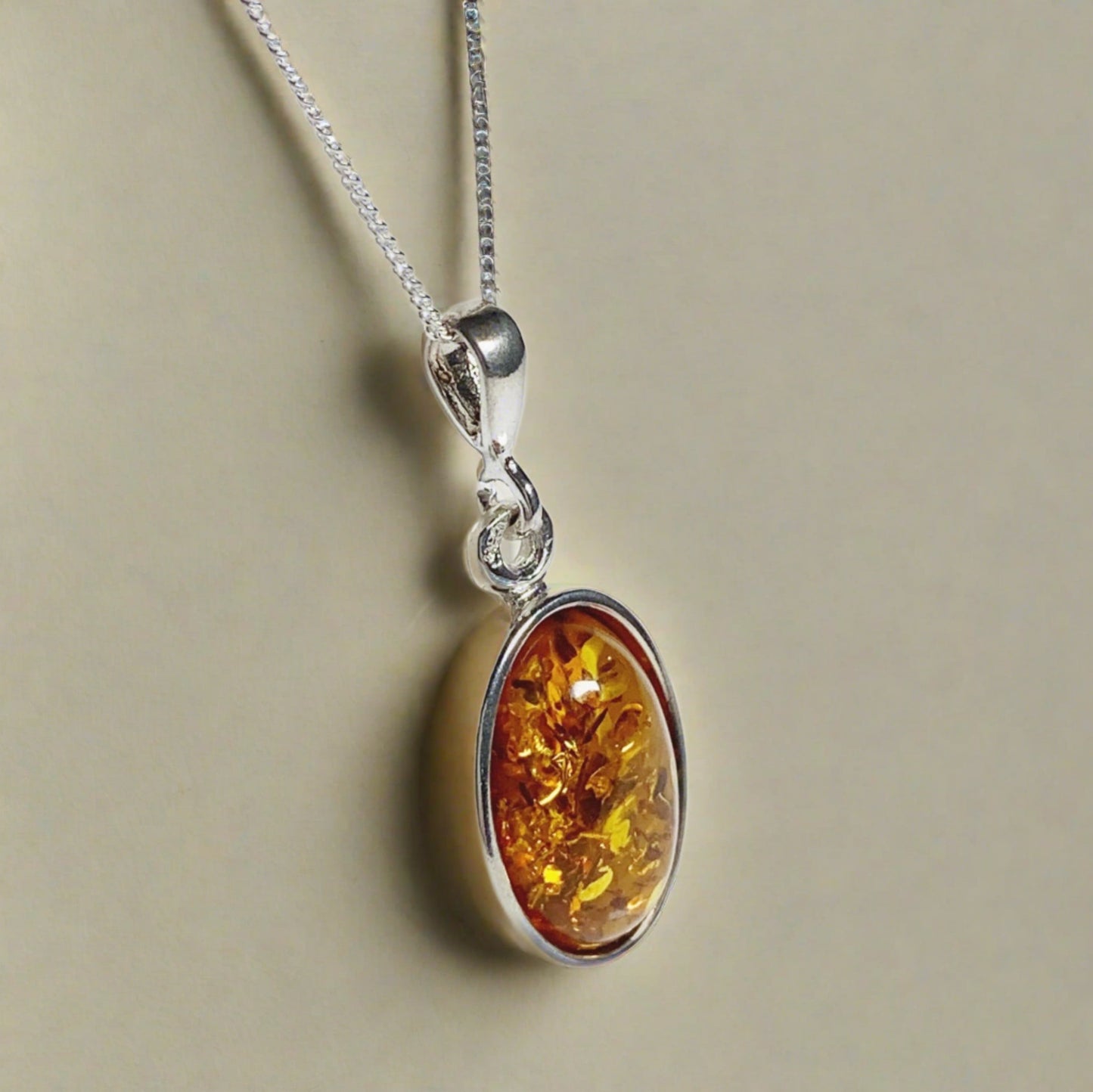 Orange amber oval sterling silver necklace