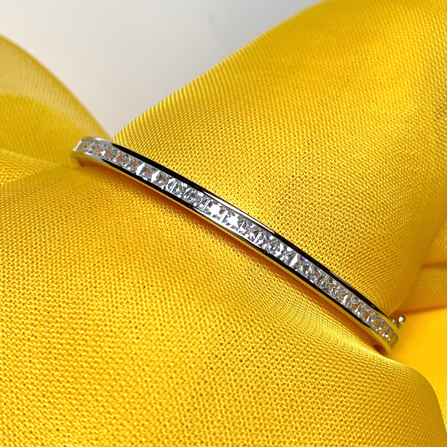 Child's Oval Bangle with Princess Cut Cubic Zirconia Sterling Silver Channel Set