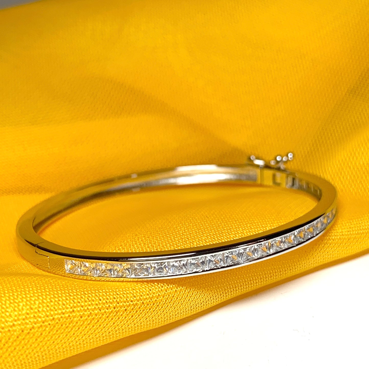 Oval Bangle With Princess Cut Cubic Zirconia Sterling Silver Channel Set