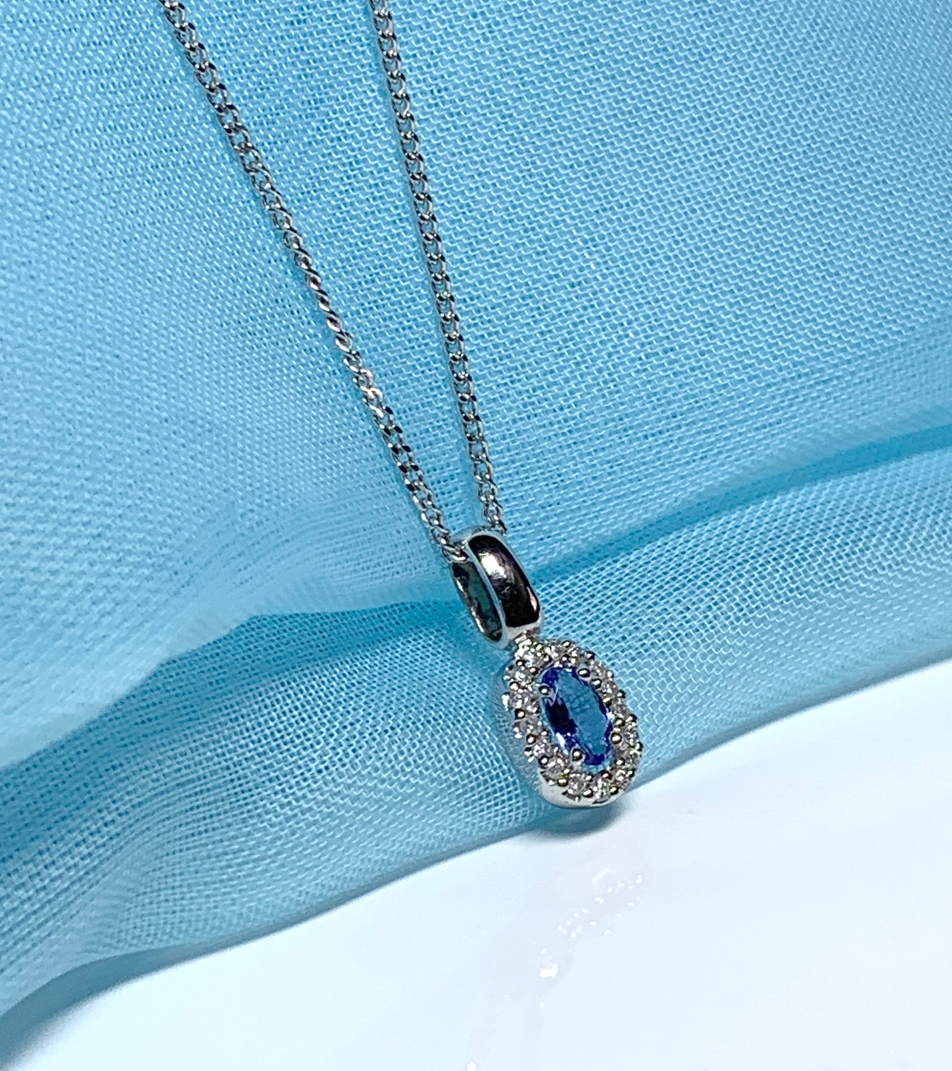 Oval cluster tanzanite and diamond white gold necklace