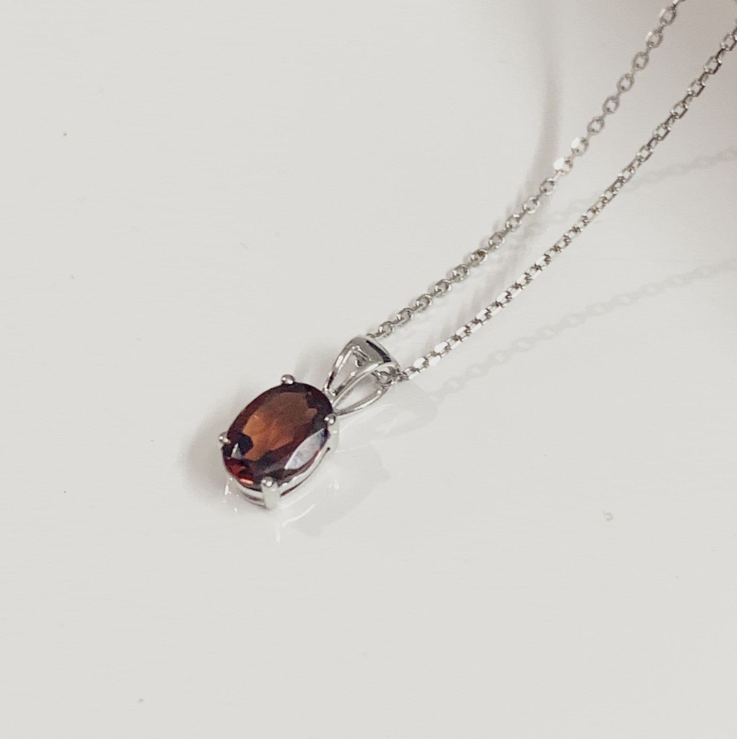 Oval red garnet necklace pendant white gold