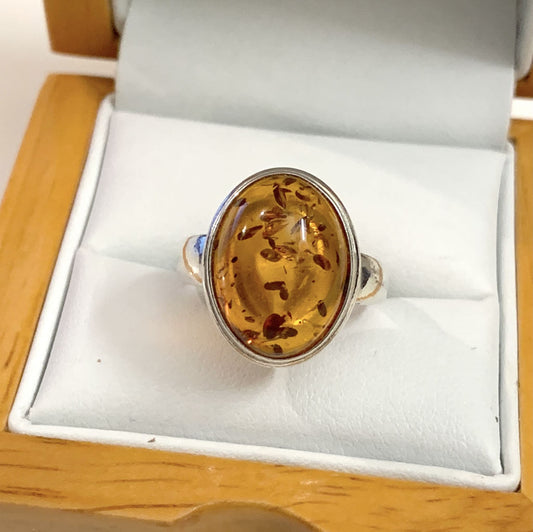 Oval Rubbed Over Sterling Silver Orange Amber Ring