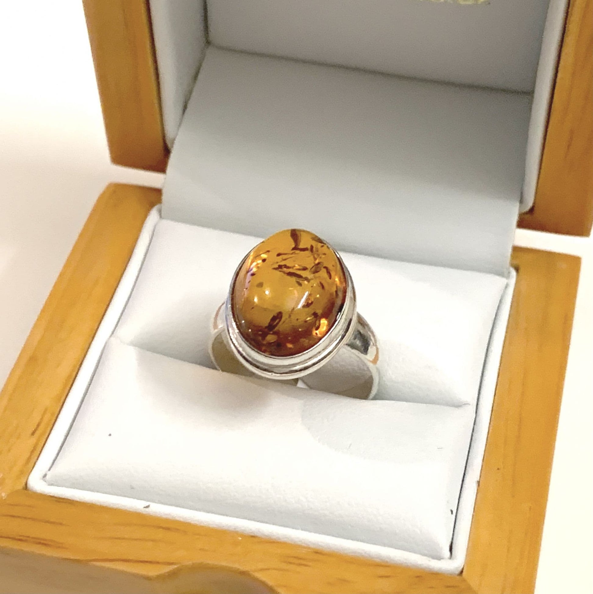 Oval Rubbed Over Sterling Silver Orange Amber Ring