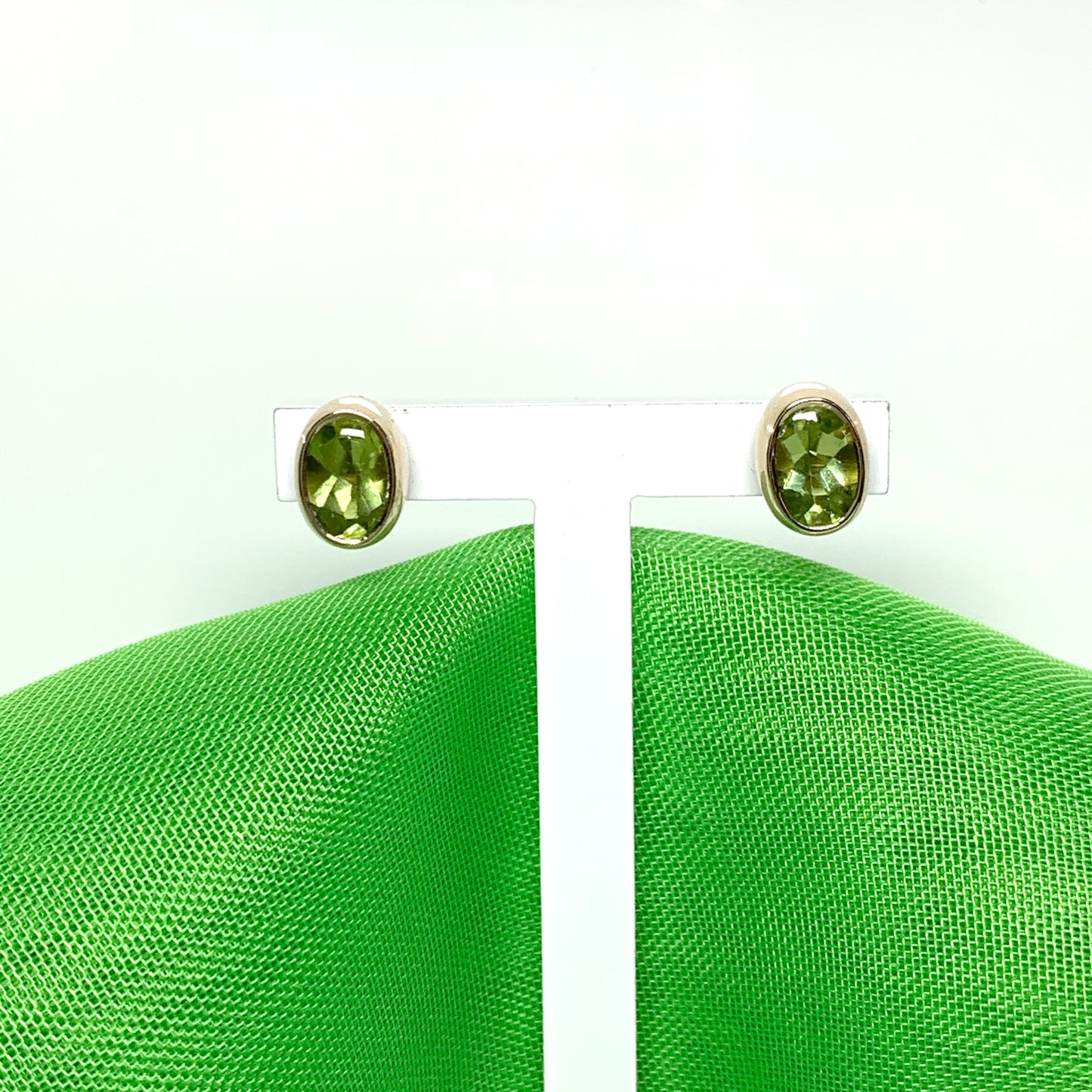 Oval Shaped Peridot Yellow Gold Stud Earrings